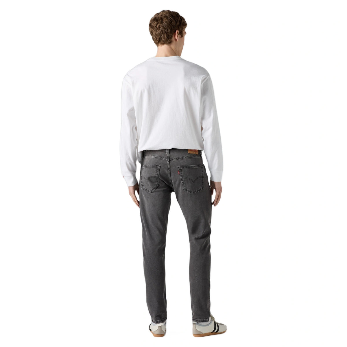 جينز بقصة ضيقة ومستدقة (Slim Taper Fit)